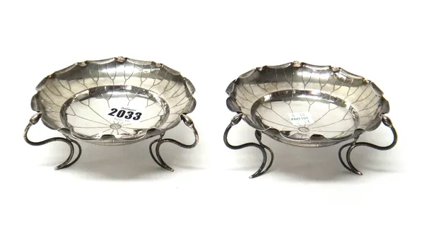 A pair of Chinese bonbon dishes, each formed as a flowerhead and raised on three wirework feet, having bud terminals, detailed WH 90, diameter 13cm, c
