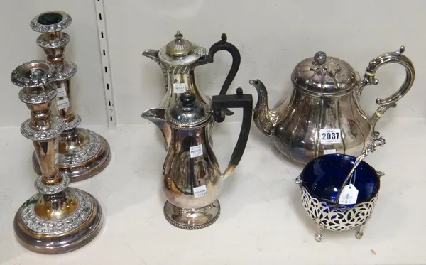 Plated wares, comprising; a teapot, two hot water jugs, a cream bowl, with a blue glass liner and a ladle and a pair of table candlesticks, (6).