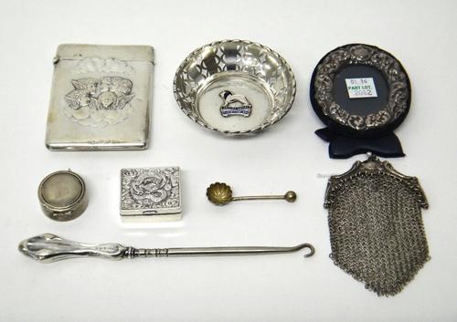 Silver and silver mounted wares, comprising; a rectangular visiting card case, decorated with winged cherubs faces above clouds, Birmingham 1908, a ci