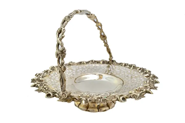 A Victorian silver cake or fruit basket, of shaped circular form, the border and the swingover handle decorated with oak leaves and acorns, otherwise