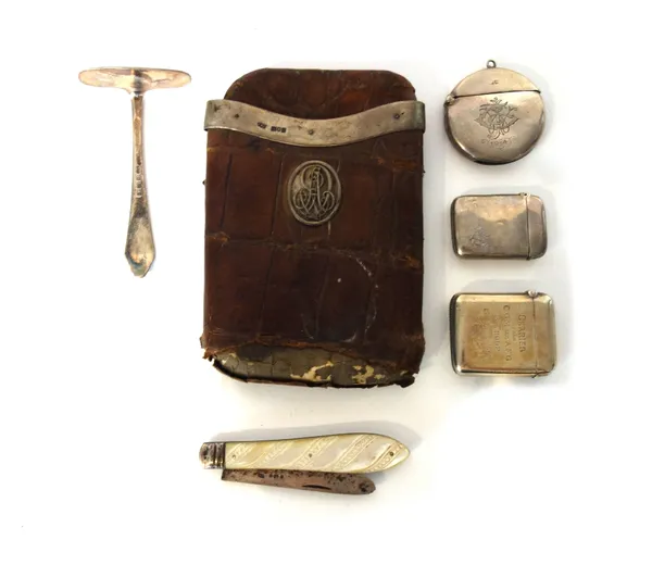 Silver and silver mounted wares, comprising; a crocodile cigar case, London 1907, a circular vesta case, Birmingham 1909, two rectangular vesta cases,