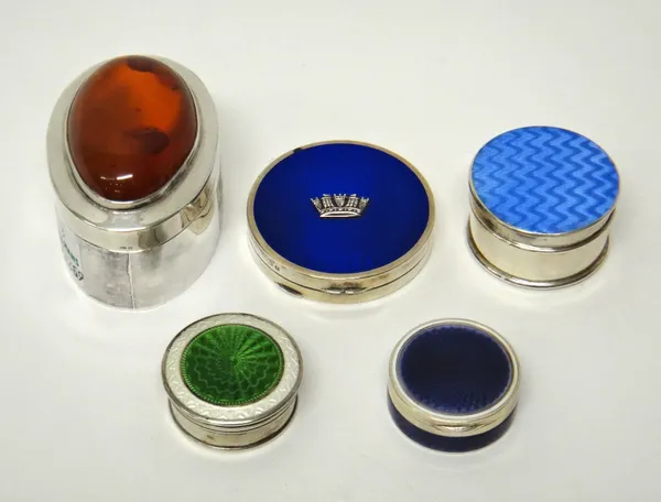 A silver and amber mounted oval box, with a pull-off lid, a lady's silver and blue enamelled circular compact, the lid with a Navy crown motif, Birmin