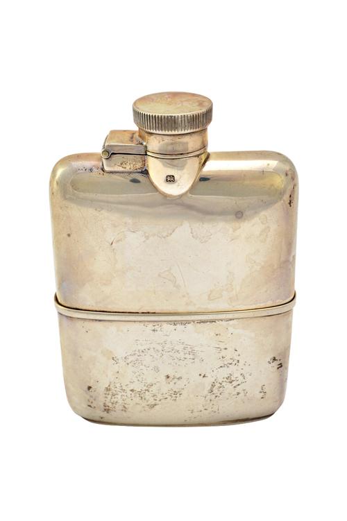 A silver spirit flask, of plain rectangular form, having a pull-off beaker base, maker Goldsmiths & Silversmiths Co Ltd, London 1930, weight 150 gms.
