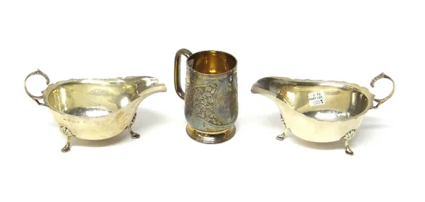 A Victorian silver christening mug, Birmingham 1888, with engraved scroll decoration and presentation inscription, together with a pair of silver sauc