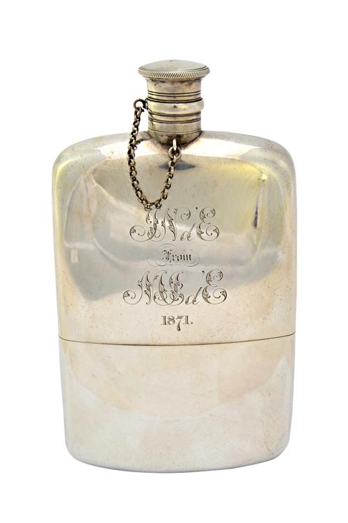 A Victorian silver spirit flask, having a pull-off beaker base, of curved rectangular form, presentation inscribed, maker Robert Hennell, London 1870,