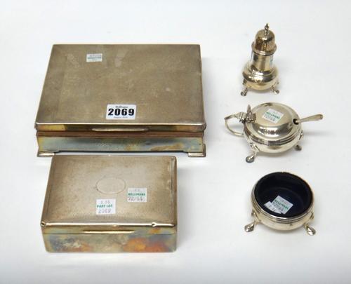 A silver rectangular cigarette box, presentation inscribed, the cover with engine turned decoration, together with another smaller silver cigarette bo