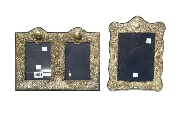 A silver mounted twin compartment photograph frame, having floral, foliate and scroll embossed decoration, London 1988 and another silver mounted shap