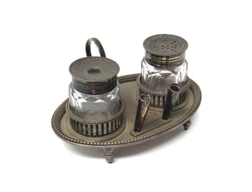 A George III silver oval desk stand by Burrage Davenport, London 1783, with beaded rim and looped handle, the centre with galleried compartments fitte