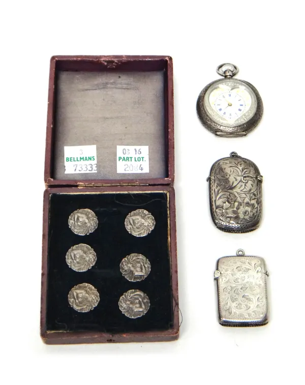 Two Victorian silver vesta cases, Birmingham 1897 and Chester 1899, a lady's keyless wind, openfaced fob watch, with a heart shaped aperture to the di
