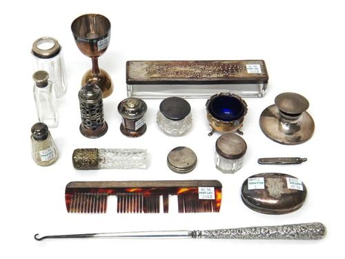 A silver pepperette by Liberty & Co, Birmingham 1915, another silver pepperette, with pierced decoration, Birmingham 1904, a silver salt with a blue g