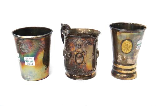 A Victorian silver christening mug, converted for use as a jug, the body decorated with floral panels and with a scrolling handle, London 1859, a Germ
