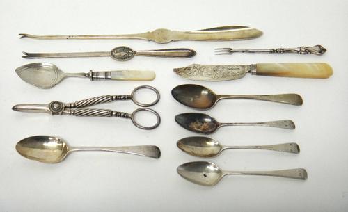 A Victorian silver bladed butter knife, with engraved decoration and with a mother of pearl handle by George Unite, Birmingham 1847, five silver spoon