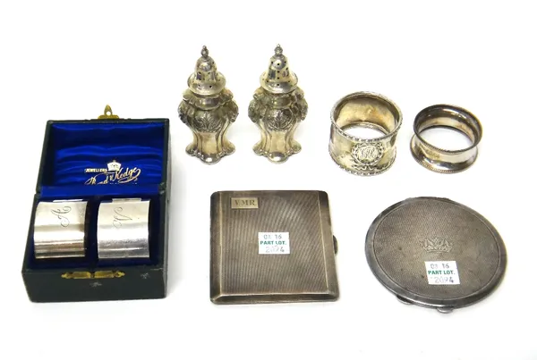 Silver, comprising; a pair of pepperettes, Sheffield 1905, a pair of oval napkin rings, Sheffield 1904, cased, two further napkin rings, a lady's circ