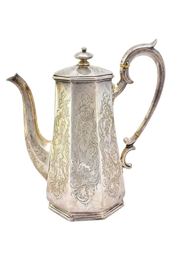 A Victorian silver coffee pot, of tapering octagonal form, with floral and scroll engraved decoration, London 1845, gross weight 720 gms.  Illustrated