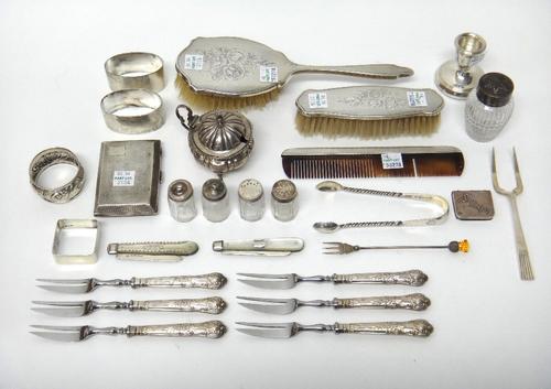 Silver and silver mounted wares, comprising; a mustard pot, with a blue glass liner, a cigarette case, four small glass condiments, a faceted glass pe