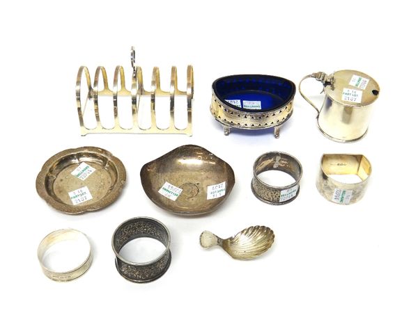 A collection of silver wares, comprising; a silver six division toast rack, Birmingham 1924, a George III silver oval salt with pierced decoration (a.