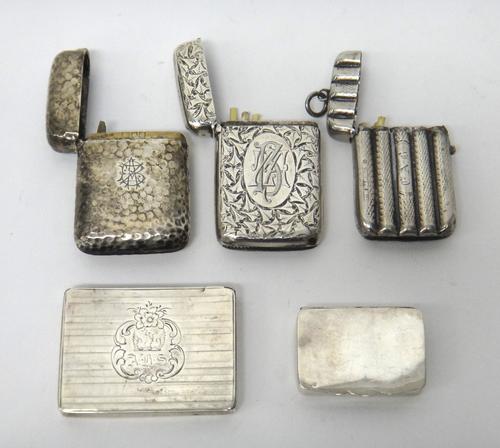 A silver vesta case of rectangular form with planished decoration, by S Mordan & Co, London 1900, together with two further silver vestas with engrave