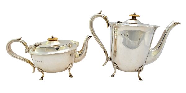 A silver four piece tea and coffee set, comprising; a teapot, a coffee pot, a twin handled sugar bowl and a milk jug, each piece of oval form, having