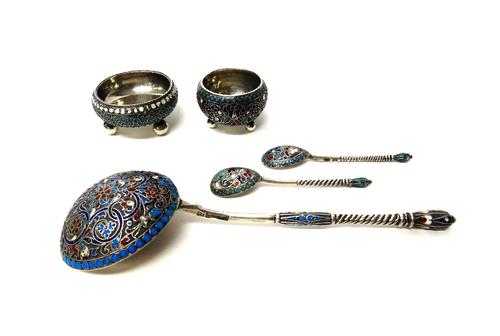 A group of Russian cloisonne enamelled wares, comprising; two differing circular salts, each raised on three spherical feet, two differing condiment s
