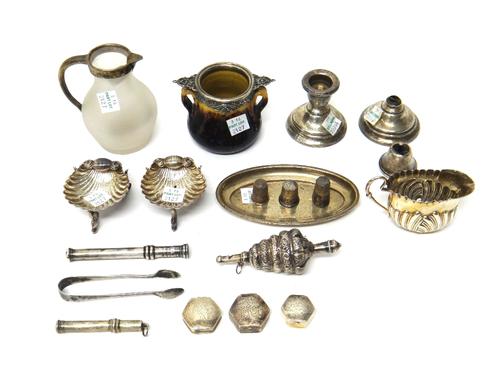 Silver and silver mounted wares, comprising; a pair of Victorian salts of scallop shell form, an oval dressing table tray, a cream jug, a baby's rattl