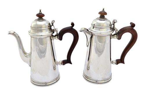 A silver two piece cafe au lait set, comprising; a coffee pot and a hot milk jug, each of tapering cylindrical form, in the 18th century taste, with b