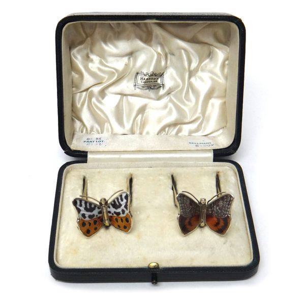 A pair of silver gilt and enamelled sweetmeat tongs, each handle formed as a differing enamelled butterfly, by Cohen and Charles, London 1911, combine