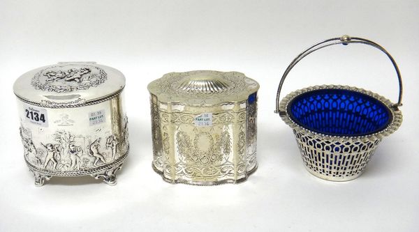 A silver tea caddy, of hinge lidded oval form, the body and the lid decorated with merrymaking classical figures in landscape settings within gadroone