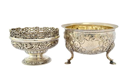 Silver, comprising; an Irish bowl, of circular form, having later floral and scroll embossed decoration, raised on three feet, Dublin circa 1800, diam