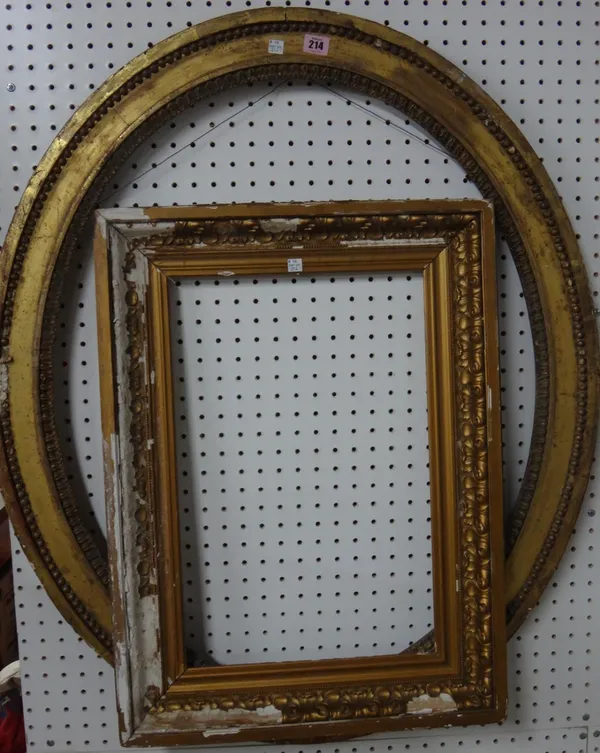 An oval gilt plaster frame, apeerture 83cm x 67cm.; together with a further smaller frame, damaged.(2)