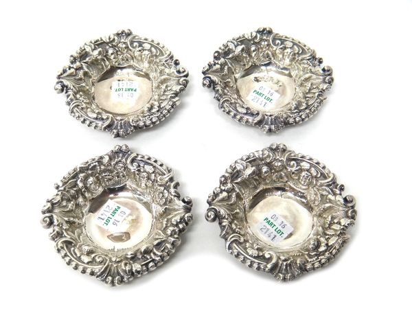 A set of four late Victorian silver bonbon dishes, embossed with flowers, foliage and fruit by Walker & Hall, Sheffield 1897, combined weight 132 gms.