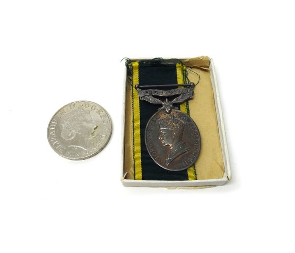 The Efficiency Medal, with bar Territorial, George VI issue to 558057 SGT.R.PETRIE. STAFFS.YEO, with the original packet and box of issue and a 2002 f