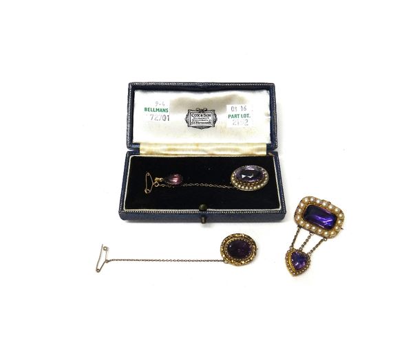 A gold rectangular brooch, mounted with a foil backed amethyst to the centre, in a surround of half pearls and with a foil backed amethyst and seed pe