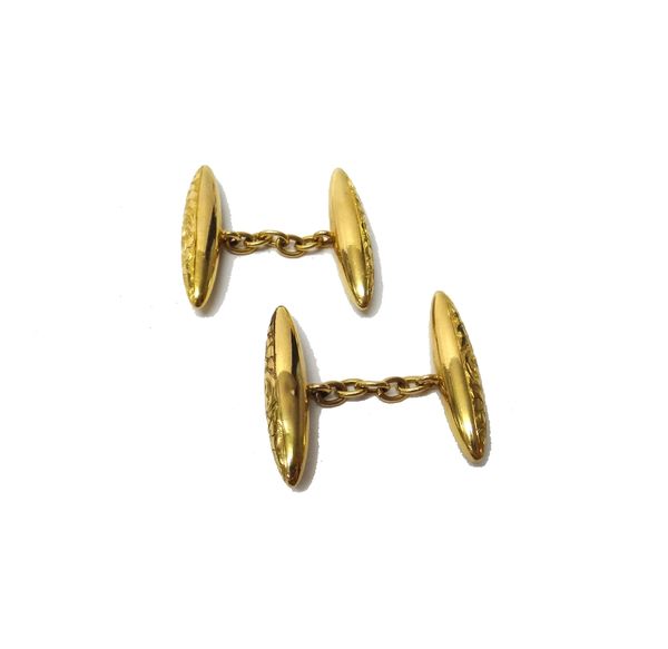 A pair of 9ct gold 'torpedo' cufflinks, with engraved decoration, Chester 1909, weight 3.1 gms and a pair of white gold cufflinks of tapering rounded