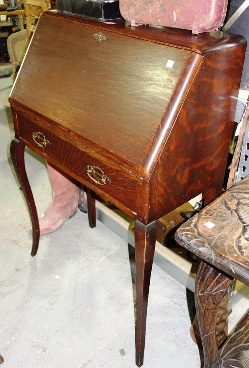 A George III oak corner cupboard, a Japanese table and a late 19th century oak bureau. (3)