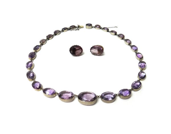 An amethyst necklace, collet set with a row of oval cut amethysts, graduating in size to the front, on a snap clasp, detailed 830, length of necklace