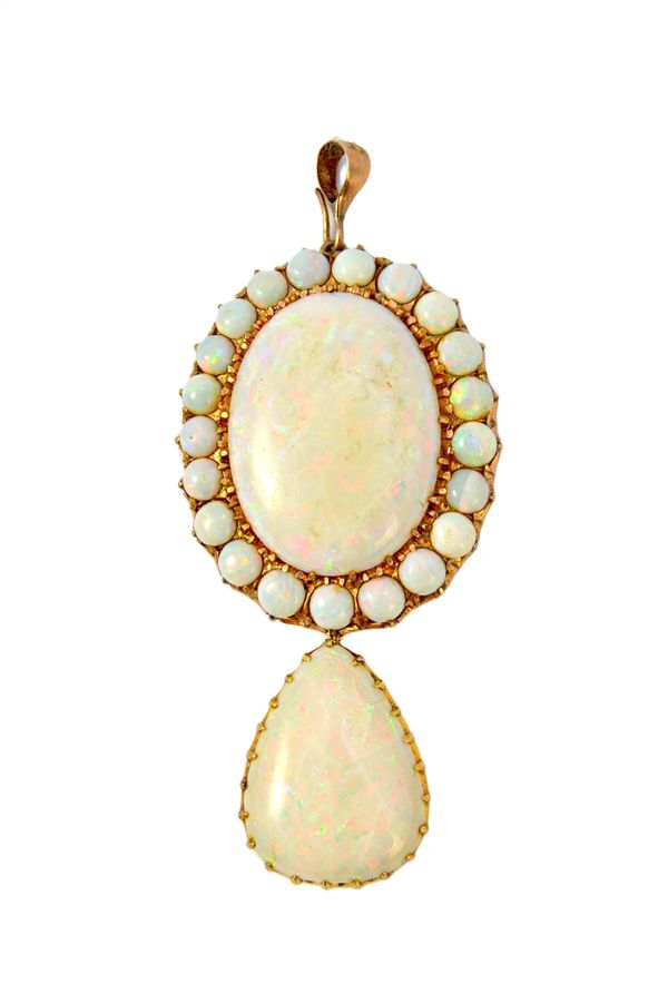 A gold and opal pendant, claw set with the principal oval opal at the top, within a surround of circular opals and with a pear shaped opal single ston