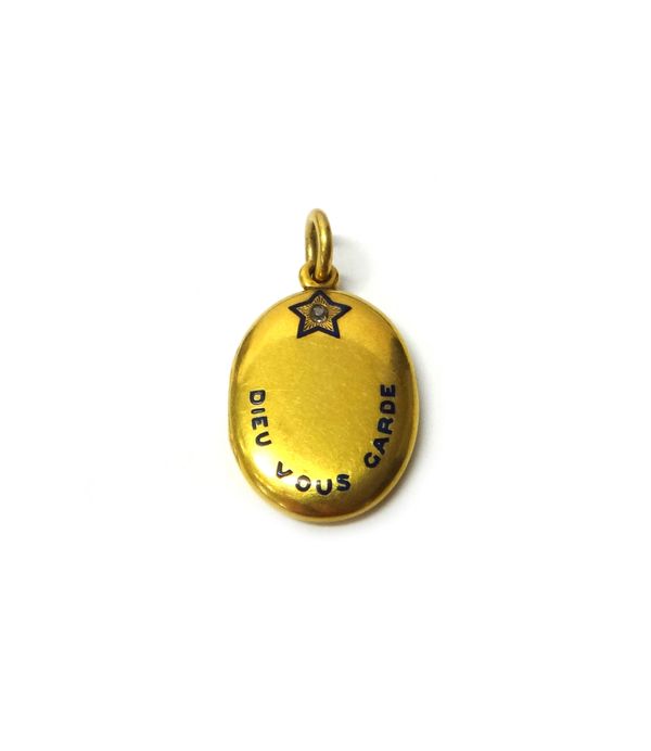 A Victorian oval yellow metal locket, the front detailed 'Dieu Vous Garde' (God Bless You) under a diamond set star, the back monogram engraved, gross