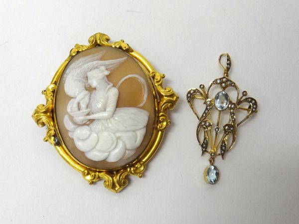 A gold, seed pearl and pale blue gem set pendant brooch, in a scrolling design and a Victorian gilt metal mounted oval shell cameo brooch, decorated w