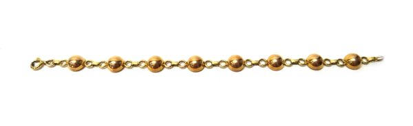 A gold bracelet, in a hemispherical circular and oval link 1940's design, on a boltring clasp, length 19.5cm, weight 13 gms.