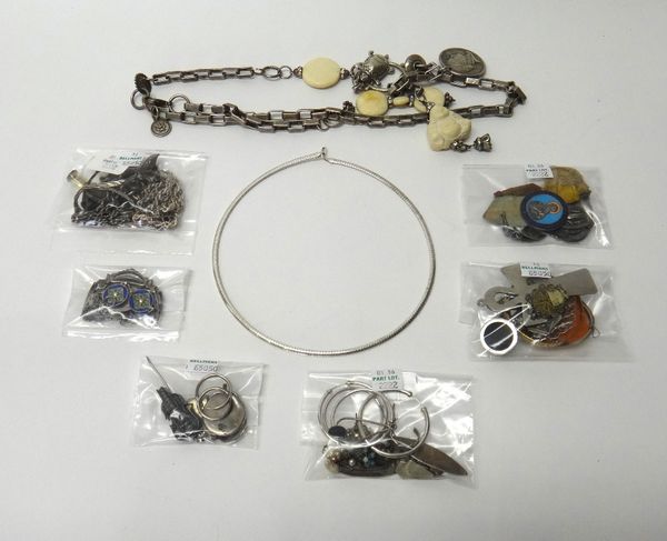 A silver curb link charm bracelet, fitted with nine charms, on a silver heart shaped padlock clasp, an oval shell cameo brooch, carved as the portrait