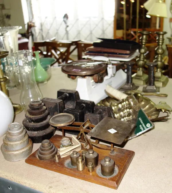 A quantity of metalware collectibles including scales, candlesticks, weights and sundry. (qty)