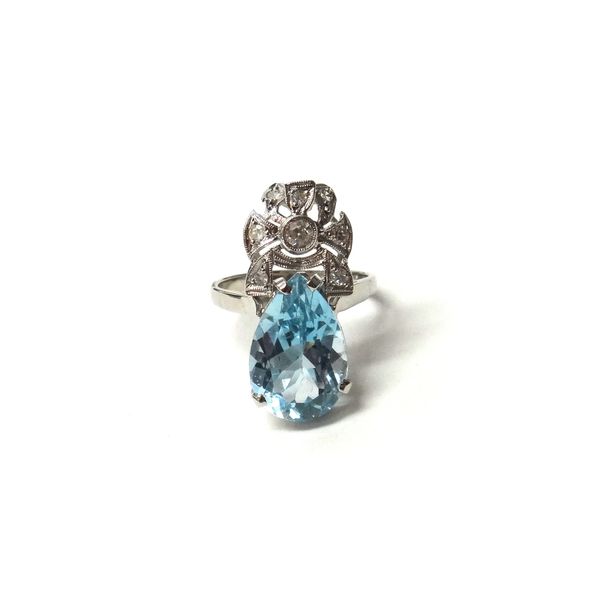 An aquamarine and diamond ring, claw set with a pear shaped aquamarine and otherwise mounted with circular cut diamonds, ring size N and a half.