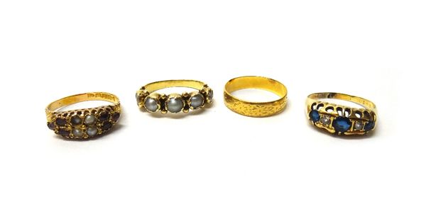 A Victorian 22ct gold decorated wedding ring, Chester 1886, a gold ring, mounted with a row of five half pearls, a Victorian 15ct gold, garnet and gem