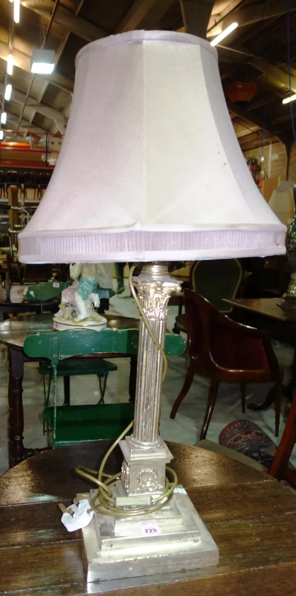 A large silver plate table lamp formed as a Corinthian column.
