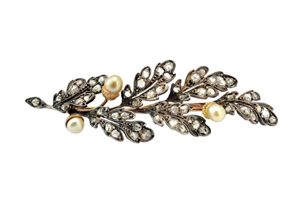 A French rose diamond and cultured pearl brooch, designed as an oak leaf and acorn spray, the leaves mounted with rose cut diamonds and the three acor