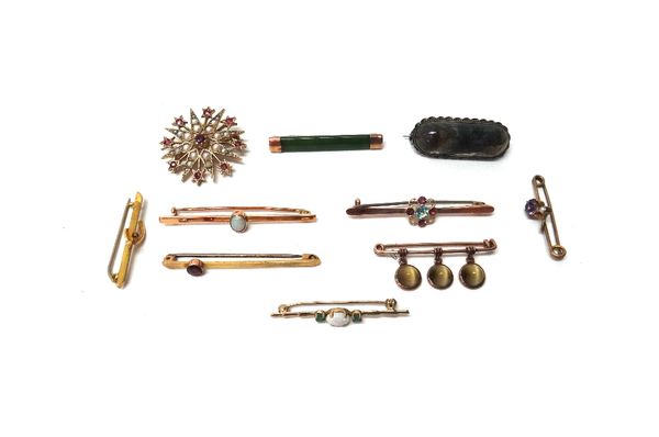 A 9ct gold, ruby and cultured pearl set brooch, designed as a starburst, a moss agate set brooch and eight mostly gem set bar brooches, in a variety o