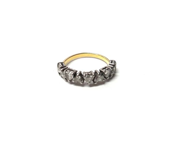 A gold and diamond set nine stone half hoop ring, mounted with a row of heart shaped diamonds in alternating positions, ring size M and a half, with a