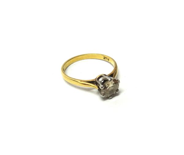 An 18ct gold and diamond set single stone ring, claw set with a circular cut diamond, ring size N.