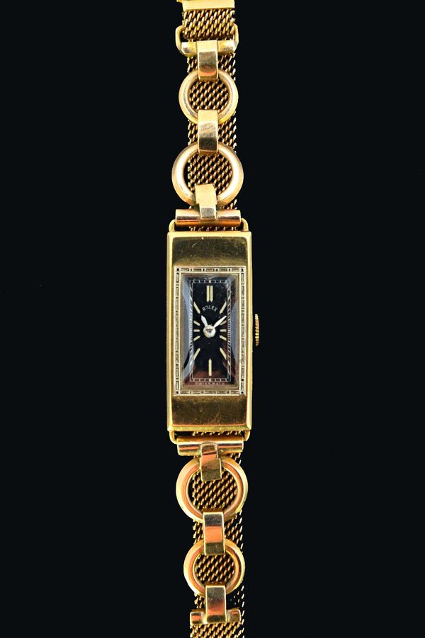 A lady's 18ct gold rectangular cased Rolex wristwatch, the jewelled movement detailed Rolex Princess Timed Six Positions, Swiss Made, the signed recta