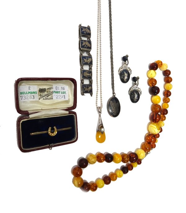 A seed pearl set bar brooch, with a horseshoe motif, cased, three items of niello decorated Siamese jewellery, comprising; an oval pendant with a neck